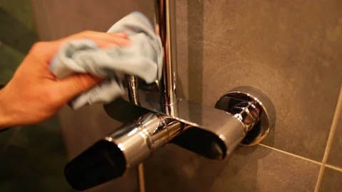 Cleaning chrome faucets in the bathroom. Stock Footage 237839591