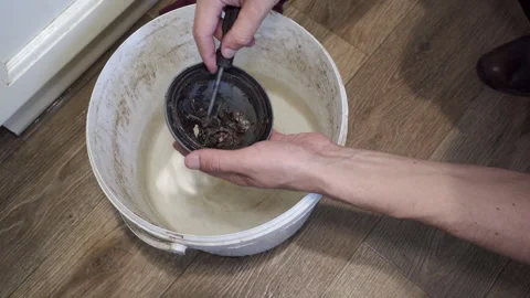 Cleaning a clogged dirty siphon Stock-Footage 312872586