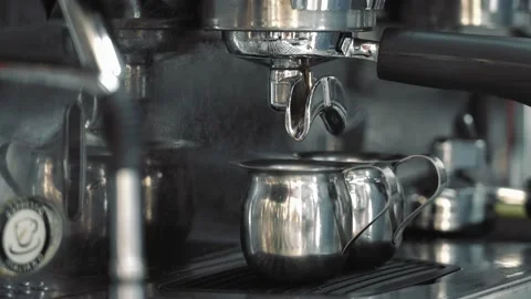 Cleaning the coffee machine, surface of a coffee machine, a lot of water steam, Video stock 133185209