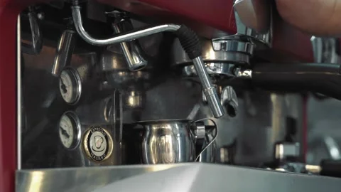 Cleaning the coffee machine, surface of a coffee machine, a lot of water steam, Video stock 133185305