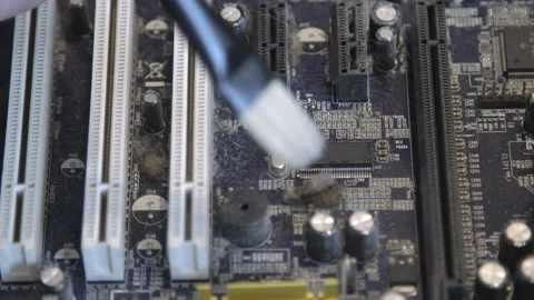 Cleaning a computer board with a brush from dust. Stock Footage 171769736