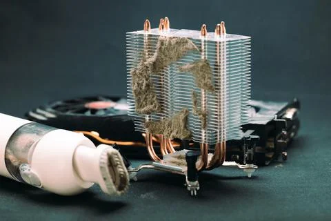 Cleaning the computer from dust and dirt with a vacuum cleaner, video card an Stock Photos