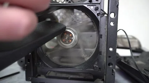 Cleaning the computer fan from dust with a brush and a vacuum cleaner. Stock Footage 328529231
