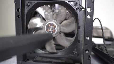 Cleaning the computer fan from dust with a vacuum cleaner. Stock Footage 328529257