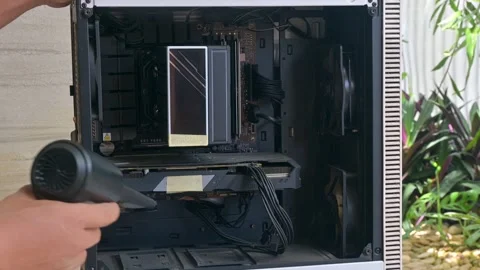 Cleaning Computer Hardware Components with Electric Air Blower Stock Footage 335202576