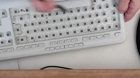 Cleaning computer keyboard with brush keycaps removed Stockbeeldmateriaal 262532121