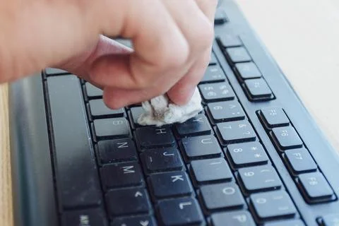 Cleaning computer keyboard. Stock Photos