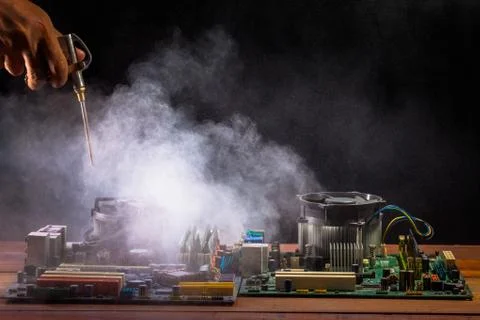 Cleaning the computer mainboard using air compressor Stock Photos