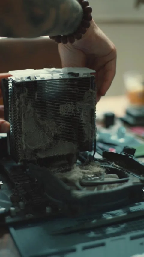 Cleaning computer parts to remove dust and dirt build-up in a PC setup at home Stock Footage 348317442