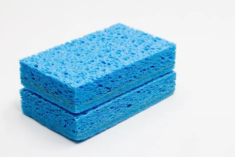 Cleaning concept, Light blue sponge for dishwashing in kitchen stacked isol.. Stock Photos