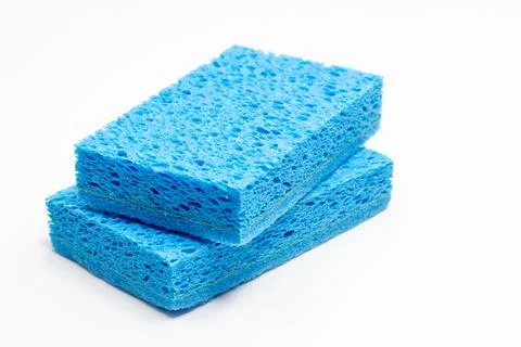 Cleaning concept, Light blue sponge for dishwashing in kitchen stacked isol.. Stock Photos