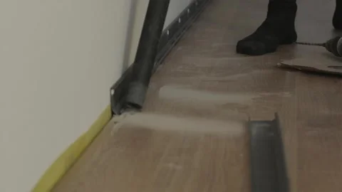 Cleaning construction dust from floor surface after renovation 스톡 동영상 346159762