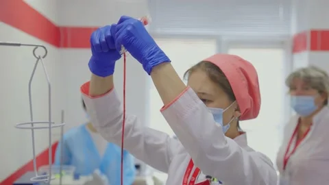 Cleaning a container of blood Stock Footage 234814298