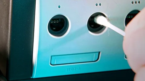 Cleaning Controller Ports on Nintendo Stock Video Pond5