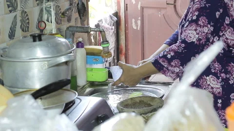 Cleaning cooking utensils. Stock Footage 289836122