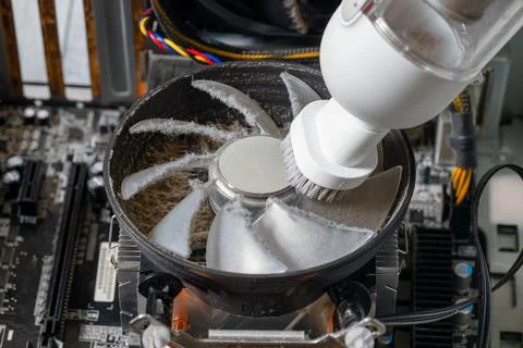 Cleaning the cooling system on a desktop computer Stock Photos