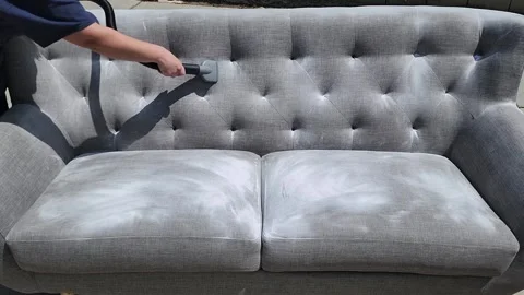 Cleaning couch with Baking Soda and vacuuming  Stock Footage 240273185