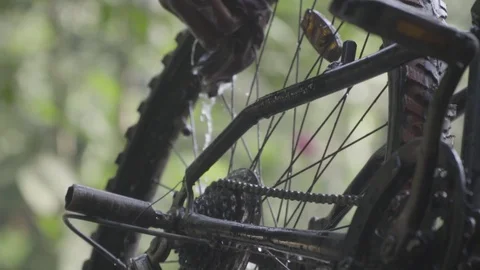 Cleaning cycle tyre being washed with water slow motion  washing bicycle kids Video stock 129928077