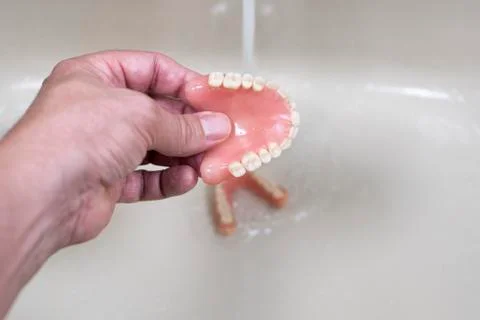 Cleaning of the denture Stock Photos