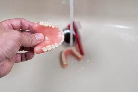 Cleaning of the denture Stock Photos
