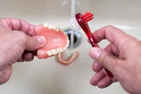 Cleaning of the denture Stock Photos