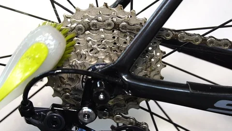 Cleaning derailleur with chain brush and rinse with water Stock Footage 110697397