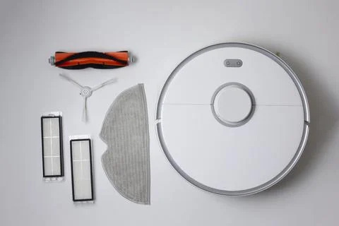Cleaning Device Components On Background. Spare Parts For Robotic Vacuum Stock Photos