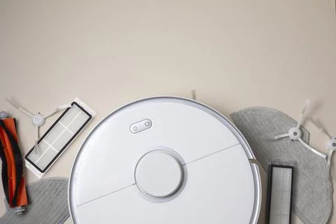 Cleaning Device Components On Background. Spare Parts For Robotic Vacuum Stock Photos