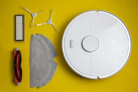 Cleaning Device Components On Background. Spare Parts For Robotic Vacuum Stock Photos