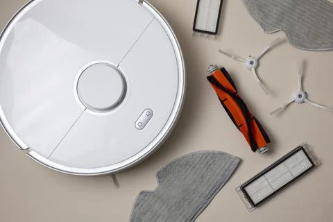 Cleaning Device Components On Background. Spare Parts For Robotic Vacuum Stock Photos