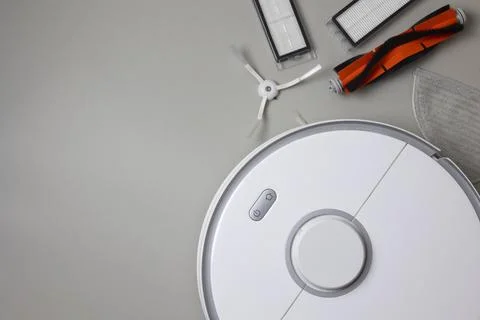 Cleaning Device Components On Background. Spare Parts For Robotic Vacuum Stock Photos