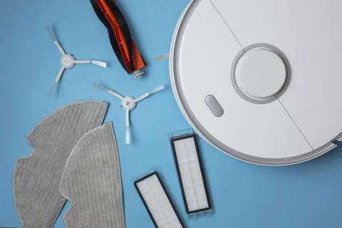 Cleaning Device Components On Background. Spare Parts For Robotic Vacuum Stock Photos