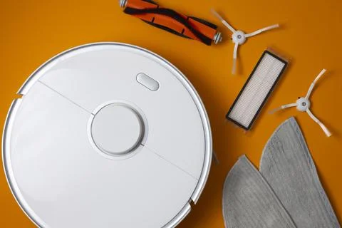 Cleaning Device Components On Background. Spare Parts For Robotic Vacuum Stock Photos