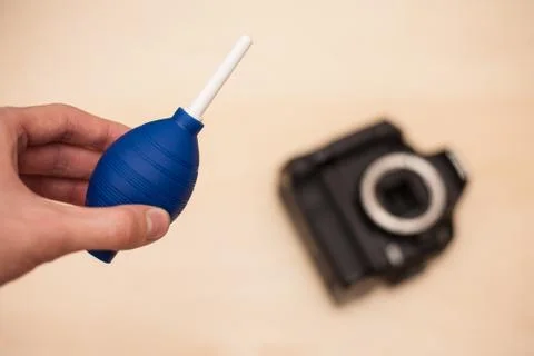 Cleaning digital camera Stock Photos