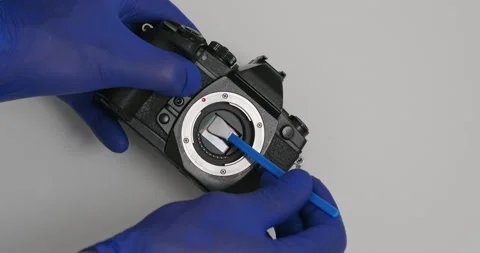 Cleaning digital mirrorless camera sensor with swab from dust and dirt. Video stock 169966386