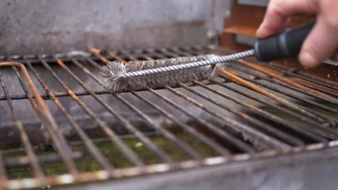 Cleaning dirty bbq grill with brush Stock Footage 161817142