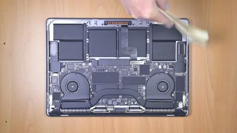 Cleaning dirty interior of a MacBook Pro laptop. Video stock 238908429