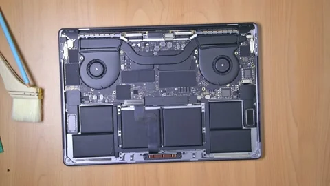 Cleaning dirty interior of a Macbook Pro notebook. Stock Footage 238908495