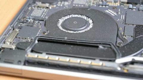 Cleaning dirty interior of a MacBook Pro laptop with canned air and toothpick. Stock Footage 238908602