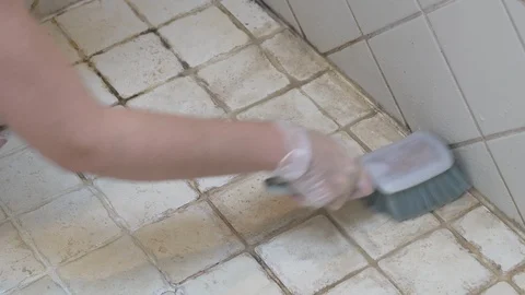 Cleaning a Dirty Tiled Floor with a Scrub Brush Vidéo 120944843