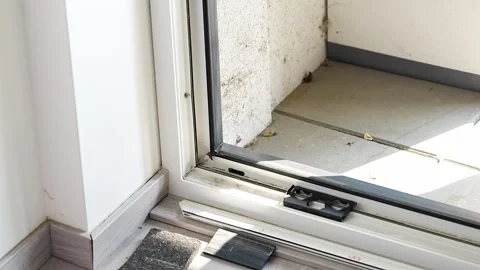 Cleaning dirty window frame with cloth before installing new glass panel Stock Footage 344519563