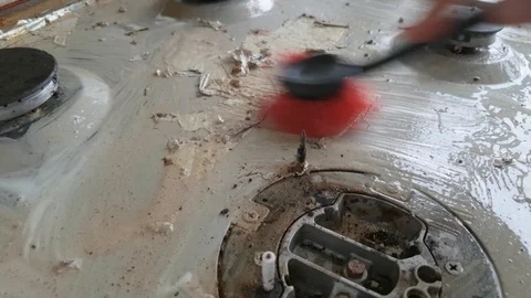 Cleaning dirty working surface of the gas stove Stock Footage 100759985