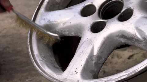 Cleaning the disc with a brush 4K Stock Footage 196735318