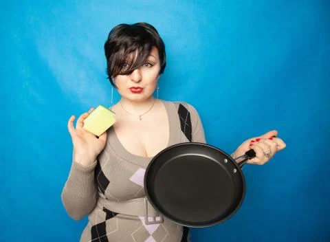 Cleaning dishware kitchen sink sponge washing frying pan. Housewife woman posing Stock Photos
