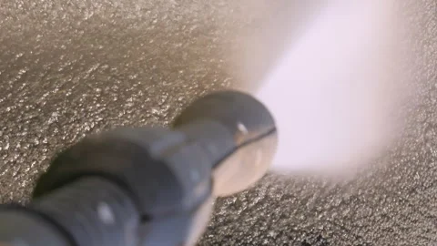 The cleaning of doormat outside the house. Sprayed with a jet of water. Stock Footage 282057952