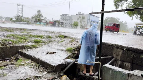 Cleaning of Drain During Heavy Rainfall Video stock 332761025