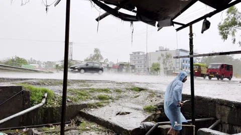 Cleaning of Drain During Heavy Rainfall Stock Footage 332761267