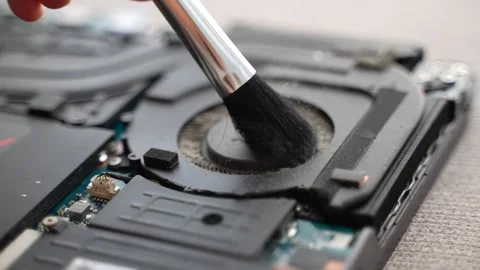 Cleaning Dust From Computer Cooling Fan With Soft Brush Stock Footage 346254960