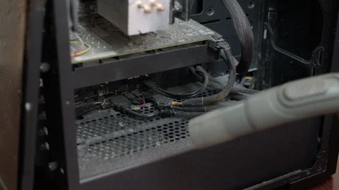 Cleaning dusty desktop computer interior with vacuum cleaner Stock Footage 334623357