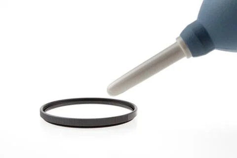 Cleaning a filter of camera with a tool Stock Photos